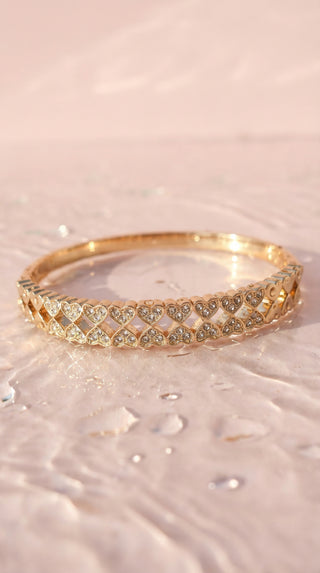 Stacked Hearts Crystal Inlaid Stainless Steel Gold Plated Hinged Bangle