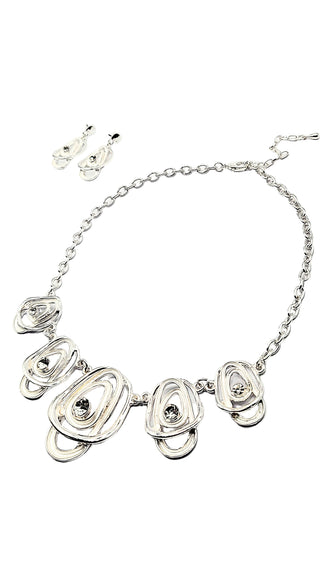 Silver necklace with floral designs on a white background